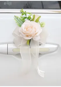 Wedding car door handle artificial rose flower with sheer ribbon bow decoration detail.