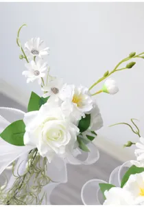 White artificial rose flower chair back decor for wedding party beach event details view.