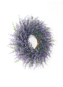 Artificial lavender wreath close up view, detailed floral arrangement for home decor.