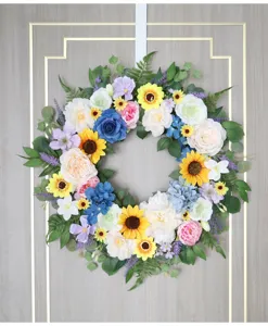Colorful artificial floral wreath with sunflowers and roses for door and wall home decor.