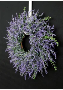 Artificial lavender wreath detail, purple floral hanging decor for home wall and wedding setup.