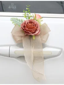 Wedding car door handle decorative flower with pink rose and bow for celebration party.