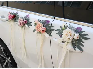 Detail shot of artificial rose wedding car door handle decoration flowers with white ribbons.