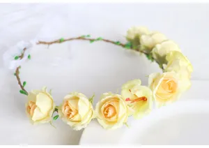 Detailed view of the forest-style floral crown with artificial roses, perfect for photography.