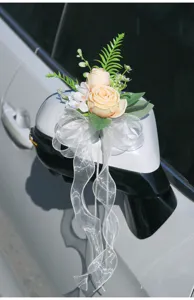 Wedding car mirror artificial rose flower decoration with white organza bow ribbon detail.