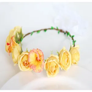 Detailed view of artificial yellow rose floral crown headband with white ribbon for women.