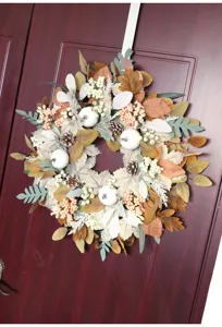 Autumn Thanksgiving maple leaf pine cone wreath for door hanging display.