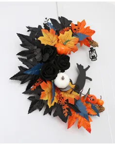 Halloween crescent moon wreath detail featuring black roses and pumpkins for spooky decor.