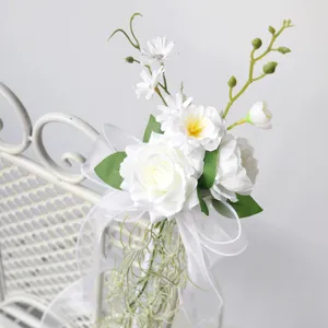 Elegant wedding chair back flower simulation floral decoration for party beach event.