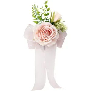 Elegant pink rose wedding car decoration with bow and green leaves, perfect for mirrors.