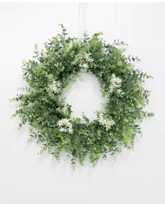 Artificial eucalyptus wreath with white flowers for front door home indoor wall decor detail view.