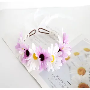 Kids floral headband with purple white daisies and ribbons for wedding flower girl hair.