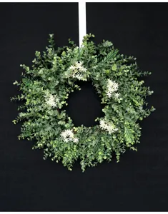 Artificial eucalyptus wreath detail view, perfect for home wall and front door decor.