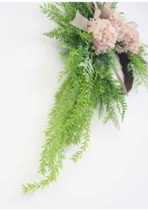 Artificial floral door wreath with pink hydrangeas green ferns and burlap bow for home decor detail view