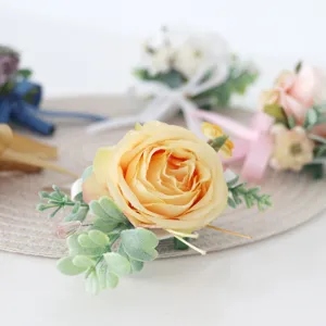Artificial rose boutonniere for wedding groom guest lapel flower celebration floral decor.
