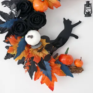 Halloween crescent cat wreath with black roses and pumpkins for autumn holiday door decor.