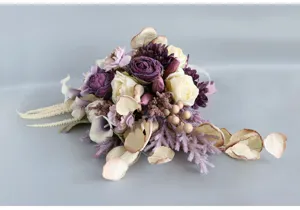 Vintage artificial bridal rose bouquet for wedding photography and romantic ceremony decor.