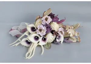 Detailed close-up view of vintage bridal artificial flower bouquet with roses, elegant style.
