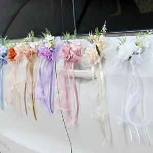 Wedding car door handle artificial flower decorations with elegant bows and long ribbons.