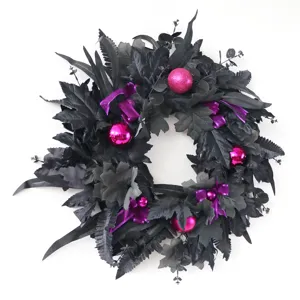 Black artificial Halloween wreath with pink ornaments for door and window home decor.