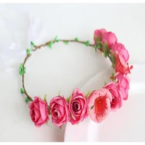 Detailed view of the fairy floral crown headband with pink roses and white ribbon for parties.