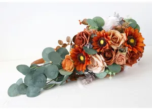 Detail view of artificial autumn wedding bridal bouquet with sunflowers roses and eucalyptus.
