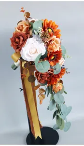 Western wedding bridal cascading artificial sunflower rose bouquet detail view with ribbons.