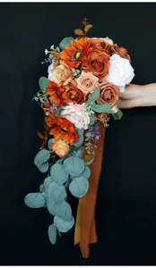 Stunning cascading artificial wedding bouquet detail featuring sunflowers, roses, and eucalyptus.