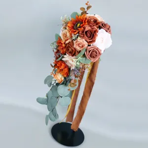 Artificial cascade bridal bouquet with sunflowers, roses, and eucalyptus for wedding decor.