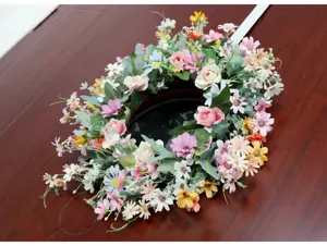 Artificial daisy flower wreath for spring garden decoration and wedding scene setup detail.