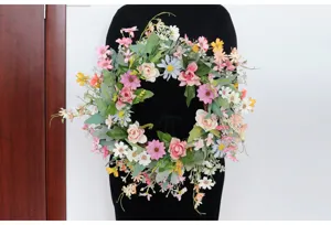 Close-up detail of artificial floral wreath in spring style for gorgeous wedding scenes.