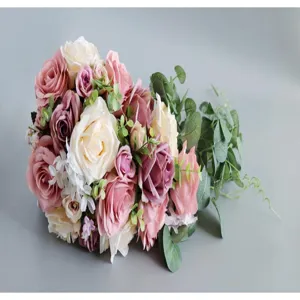 Artificial rose cascade bouquet detail close-up, pink and white wedding floral photography props.