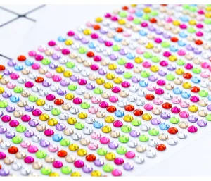 Detailed close-up of colorful acrylic rhinestone stickers for creative DIY crafts decoration