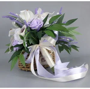 Artificial bridal wedding bouquet with white lilies purple roses and ribbons detail