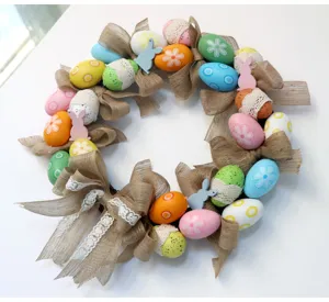 Easter egg wreath with burlap bows and cute rabbits for spring holiday door home decoration
