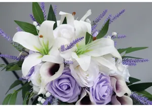Stunning artificial wedding bridal hand bouquet featuring silk roses and lilies for decor.