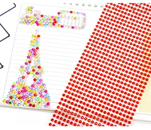 Detailed view of 4mm red and colorful acrylic rhinestone stickers for DIY craft decoration.