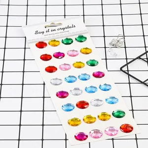 Close-up detail of colorful round acrylic rhinestone stickers arranged neatly on a white backing.