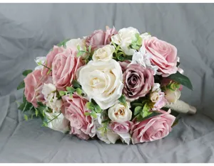 Artificial cascade wedding bridal bouquet, pink and white silk roses for wedding ceremony.