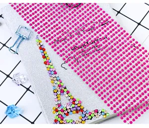 Acrylic rhinestone sticker detail showing colorful crystal diamonds and Eiffel tower design.