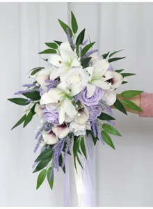 Stunning cascading bridal bouquet featuring artificial white lilies, purple roses and lavender.