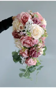 Artificial cascade bridal bouquet wedding rose flowers hand holding floral decor setup