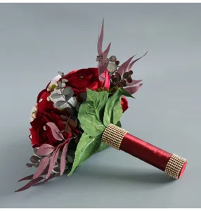 Stunning artificial red rose bridal bouquet with sparkling rhinestone handle for wedding decor.