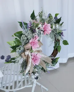 Artificial dahlia wreath with green leaves and burlap bow for home wall decor detail view