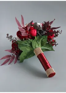 Elegant artificial bridal rose bouquet with rhinestone handle and dark leaves for wedding decor.