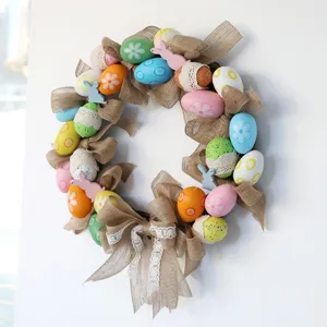 Easter egg wreath with burlap bow and colorful decorative eggs for holiday door decoration.