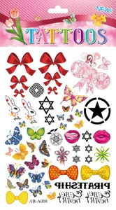 Colorful temporary tattoo sheet with cute butterflies bows and fashion designs for body art.