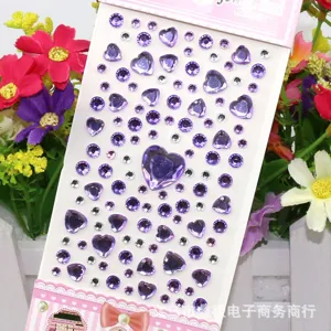 Acrylic rhinestone stickers with purple heart and round gems for DIY phone decoration crafts.