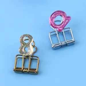 Creative metal binder clips with glitter epoxy numbers and letters for office and stationery use.