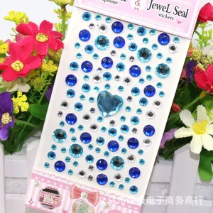 DIY acrylic rhinestone sticker sheet with blue gems and heart design for phone decor.